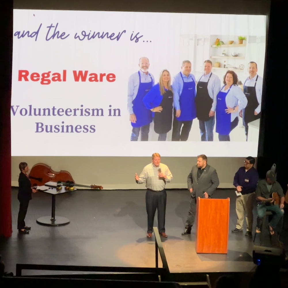 Regal Ware President/CEO Ryan Reigle accepts the award at the Champions of Change ceremony